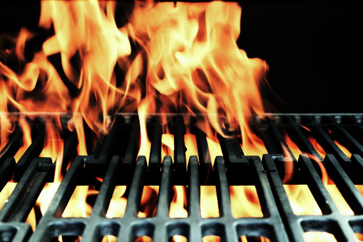 image of flames coming through on a barbeque